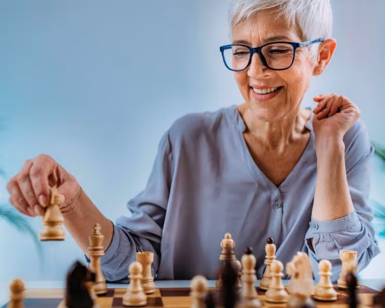 senior woman playing chess