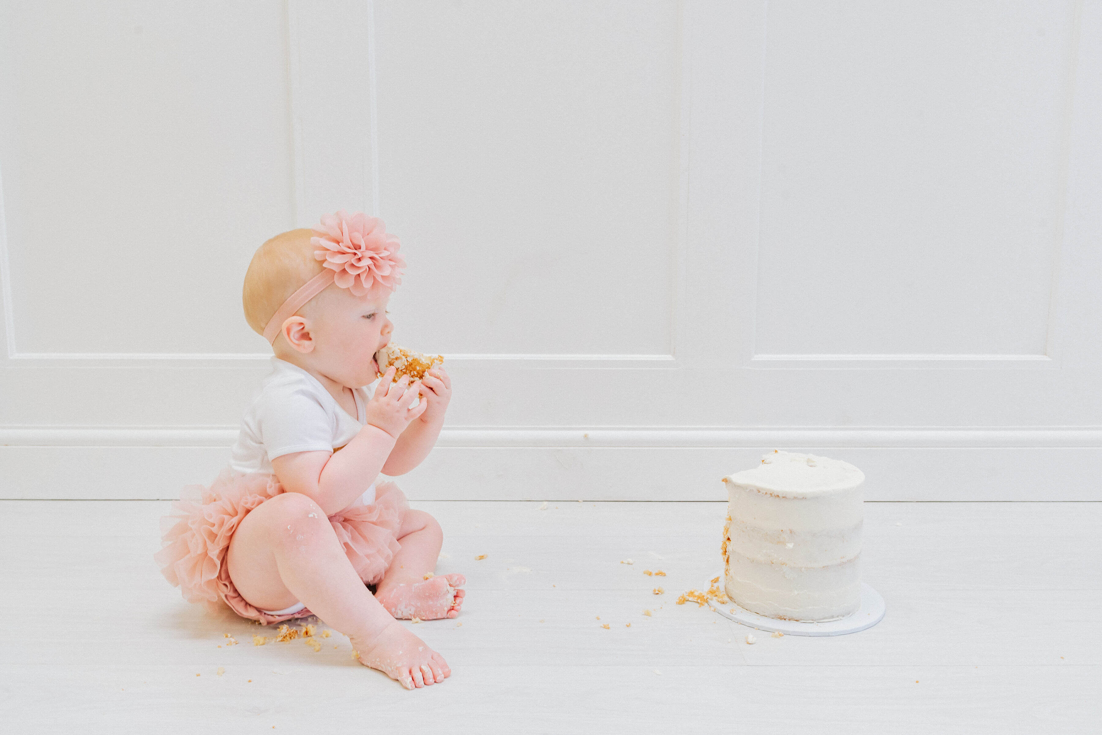 Baby Delilah eating her smashed birthday cake, shot by Gemma Randall ©