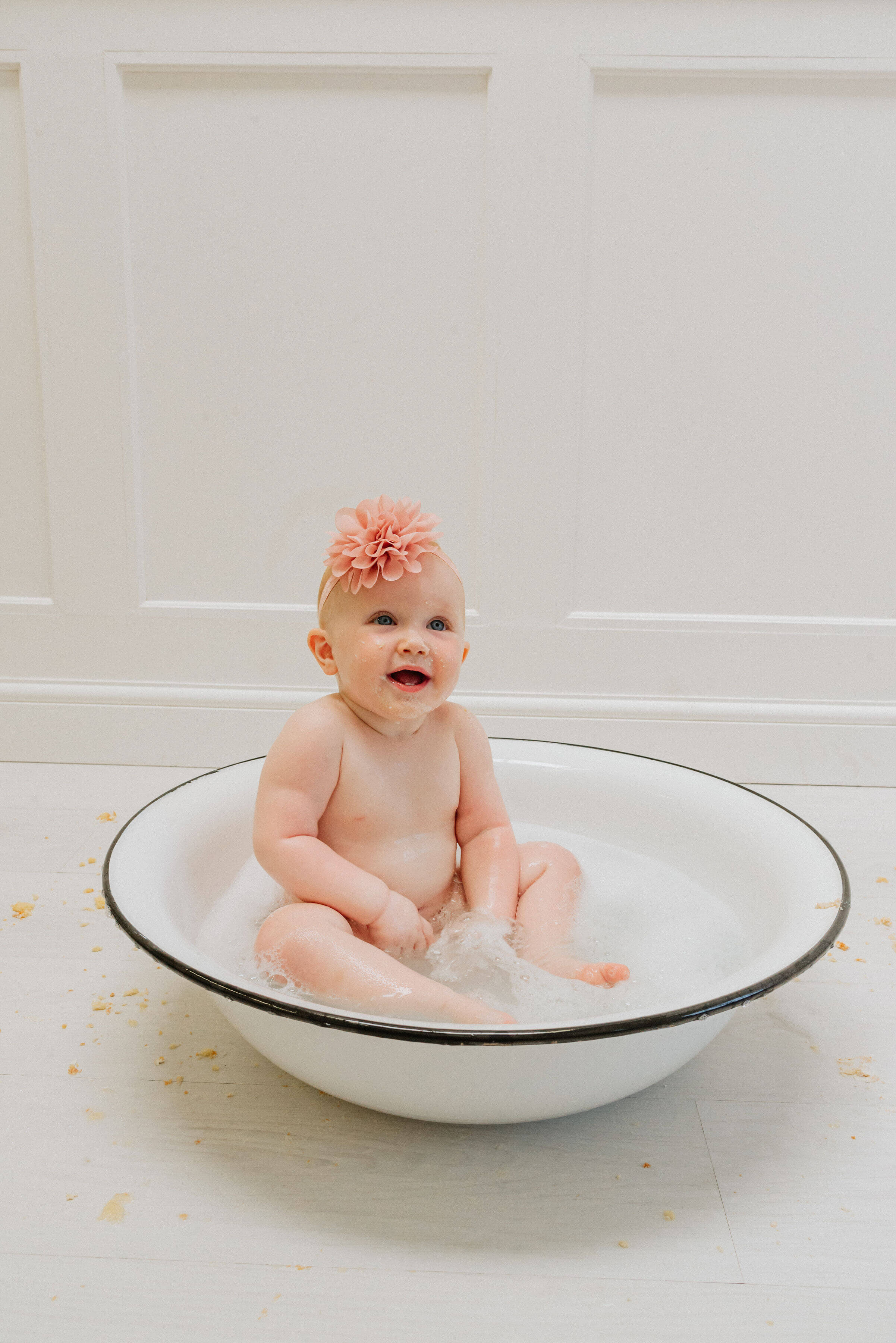 Baby Delilah in a pool of water, shot by Gemma Randall ©