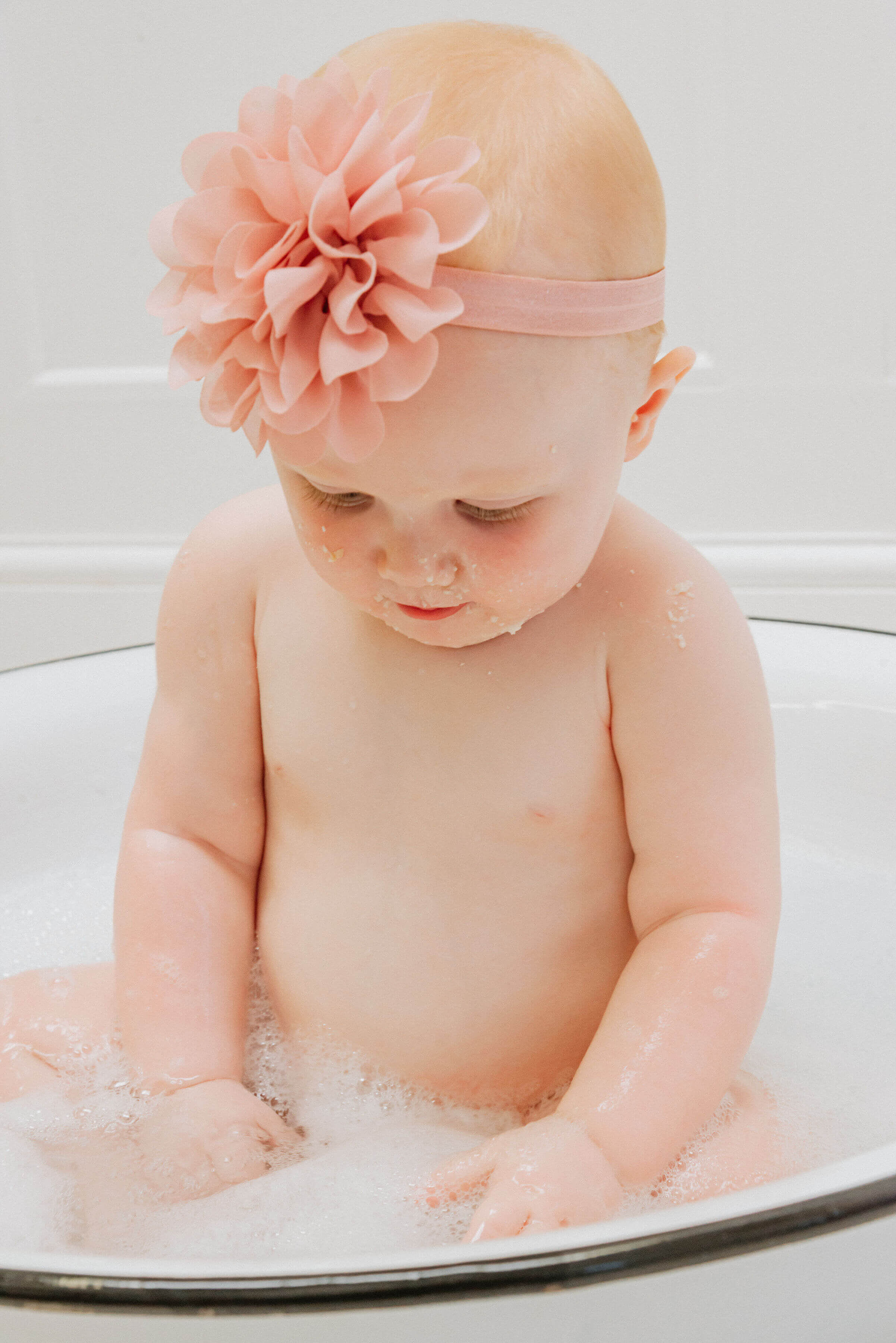 Baby Delilah in a pool of water, shot by Gemma Randall ©