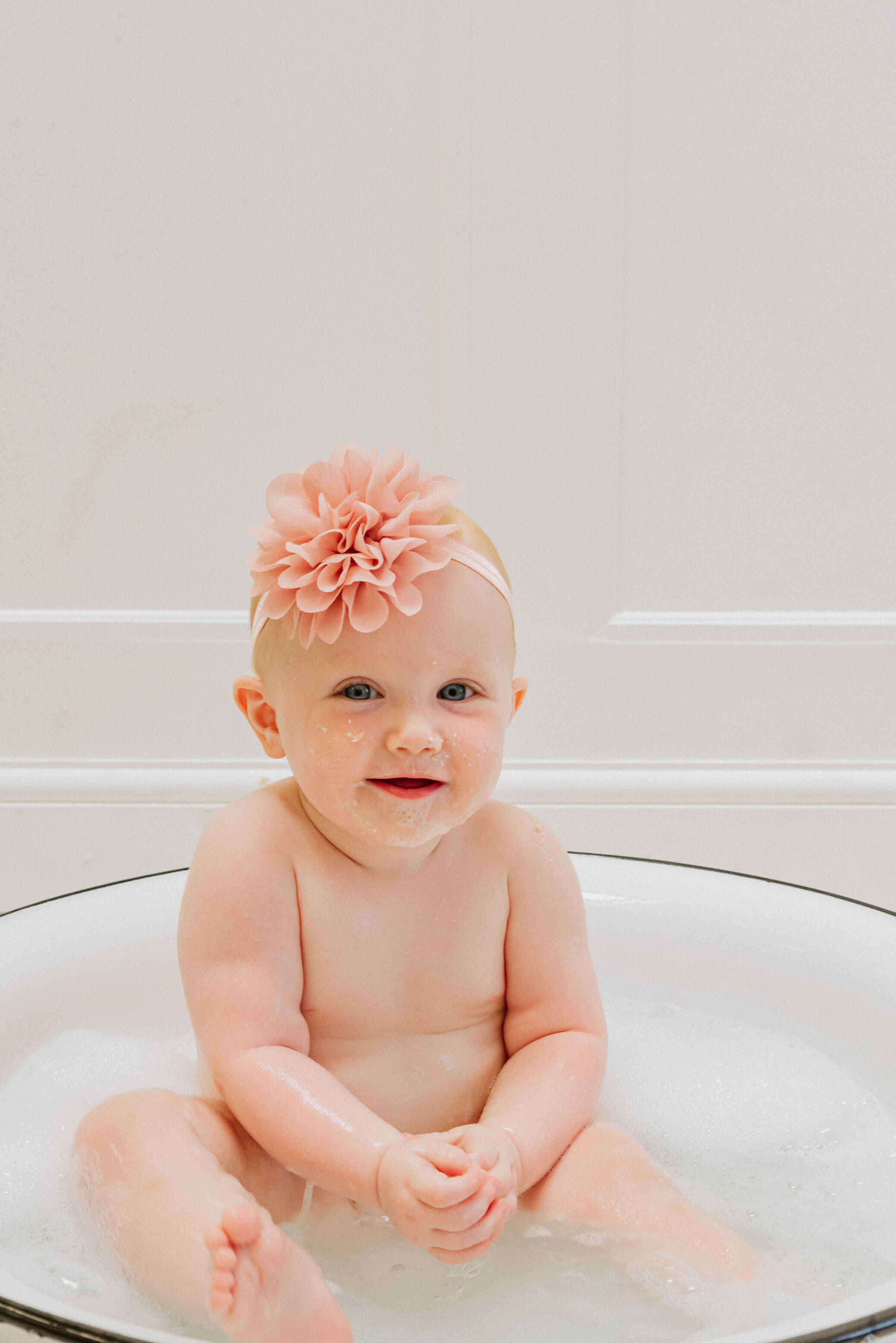 Baby Delilah in a pool of water, shot by Gemma Randall ©