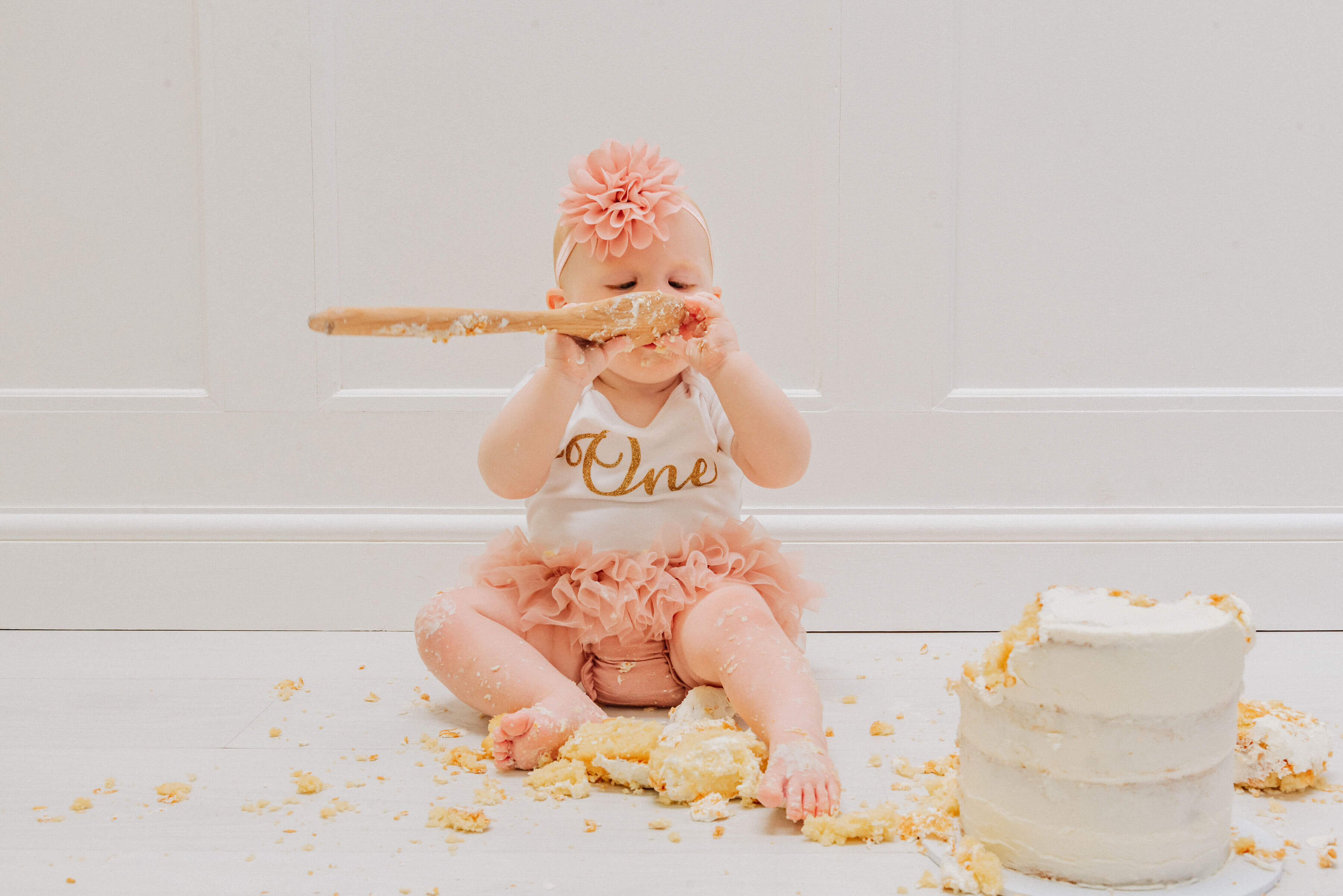 Baby Delilah licking the cake spoon, shot by Gemma Randall ©
