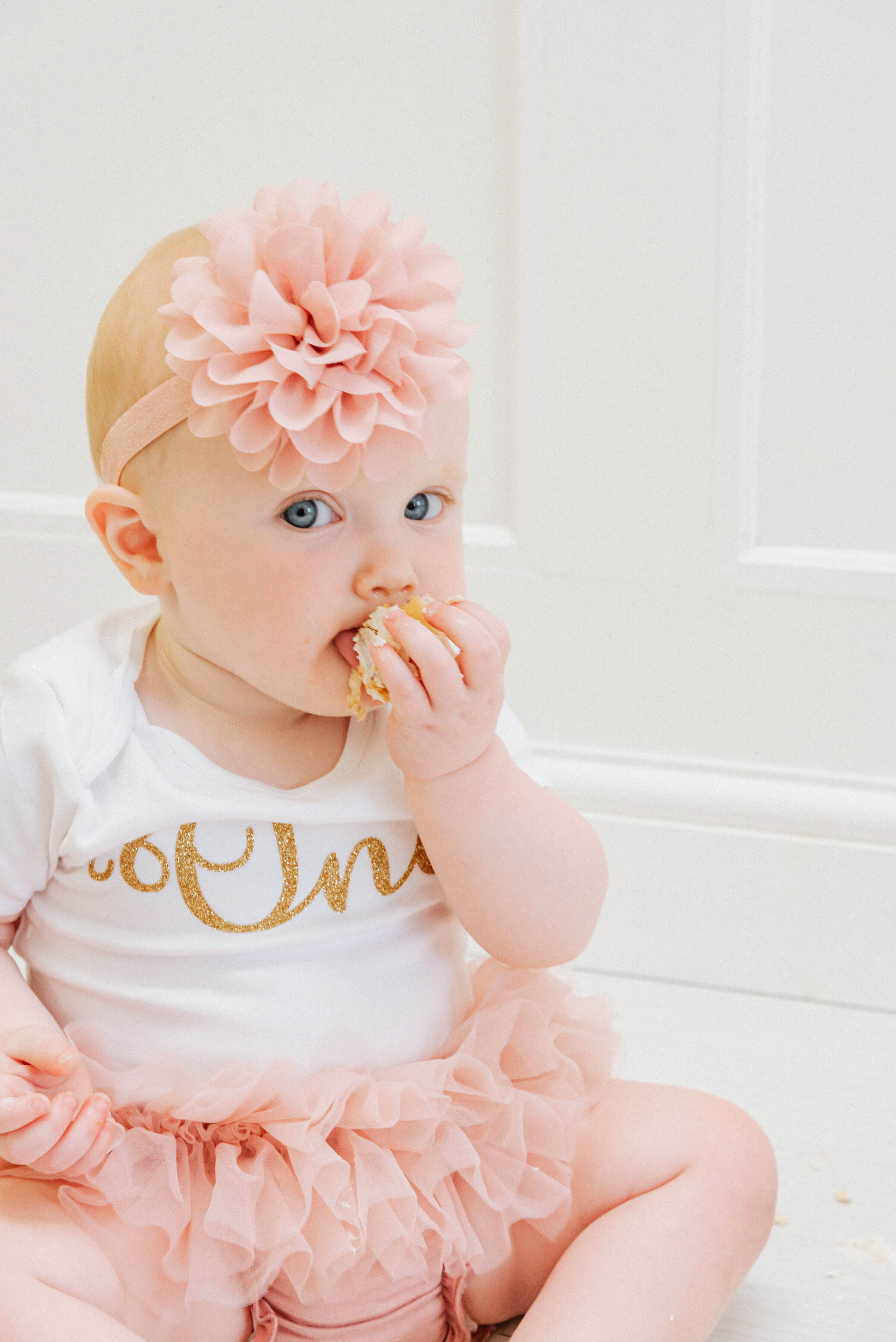 Baby Delilah eating her birthday cake, shot by Gemma Randall ©