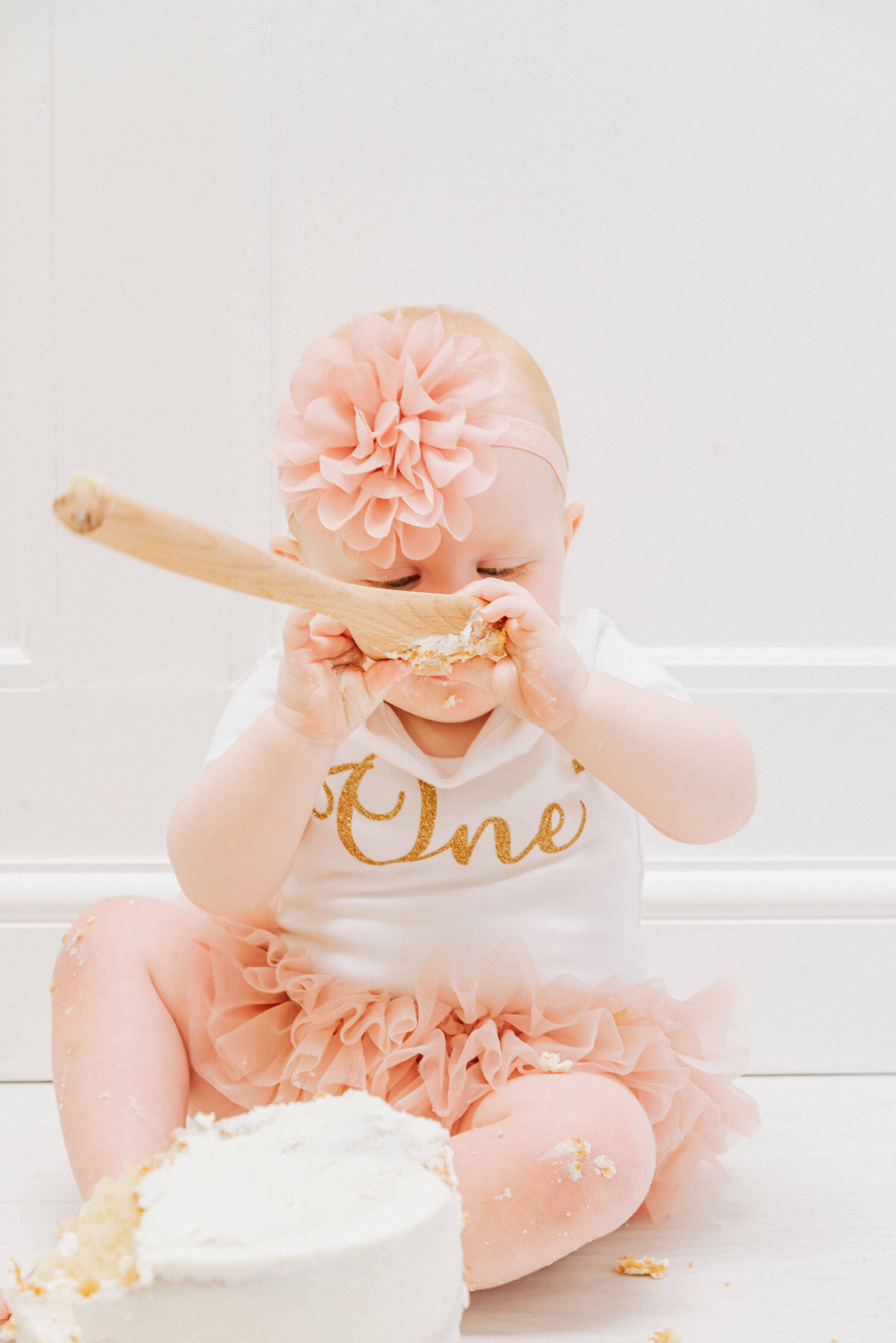 Baby Delilah licking the cake spoon , shot by Gemma Randall ©