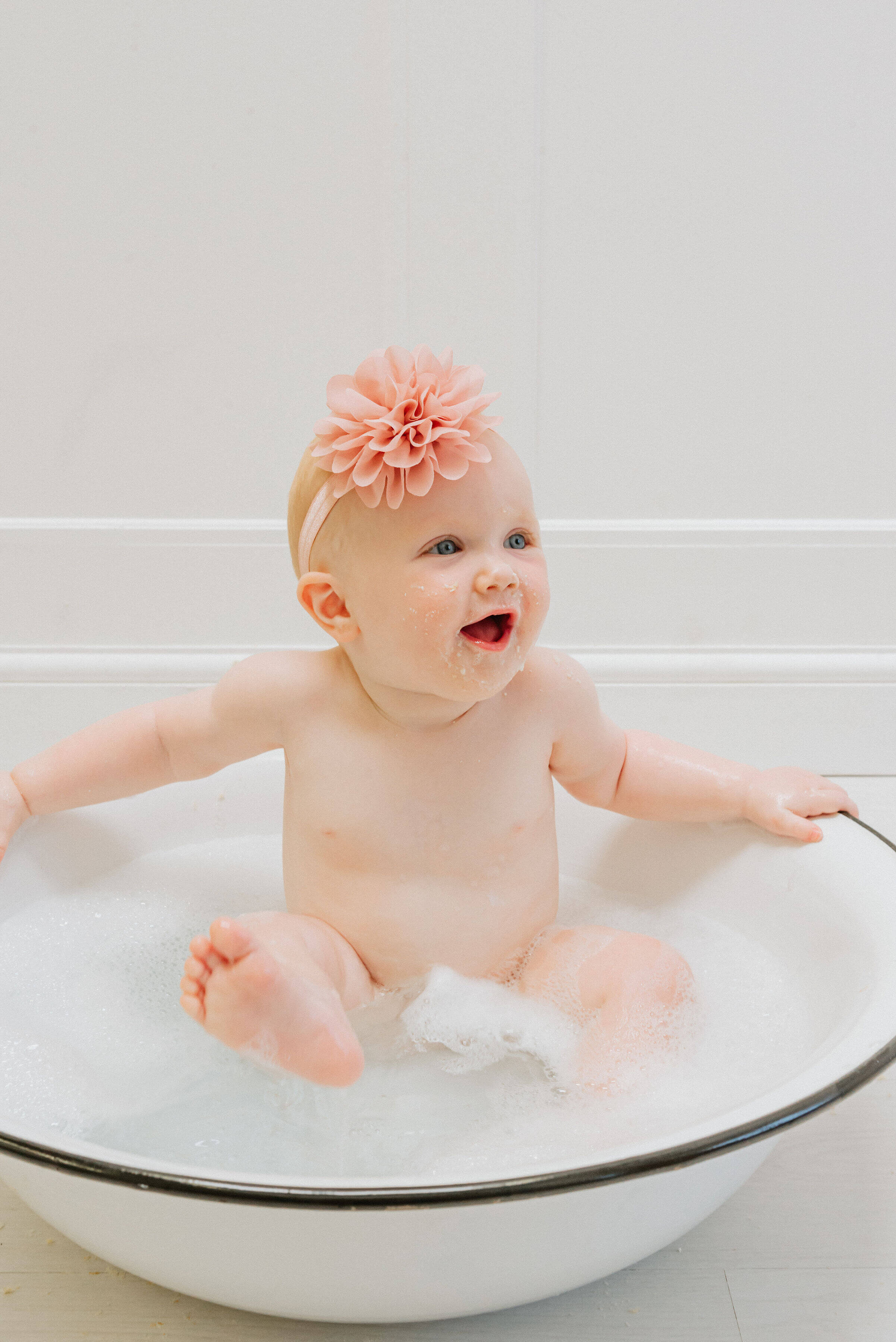 Baby Delilah in a pool of water, shot by Gemma Randall ©