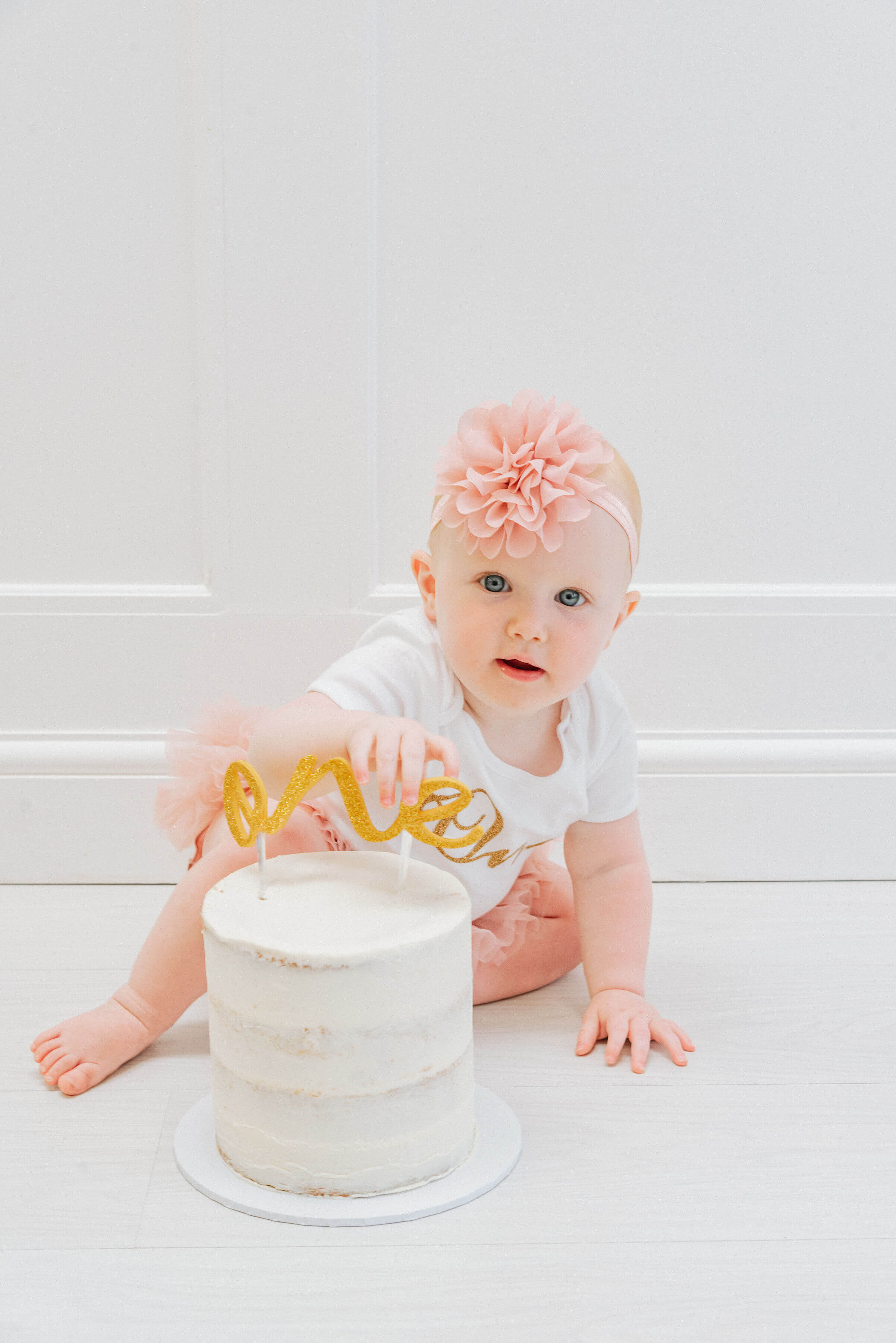Baby Delilah smashing her birthday cake, shot by Gemma Randall ©