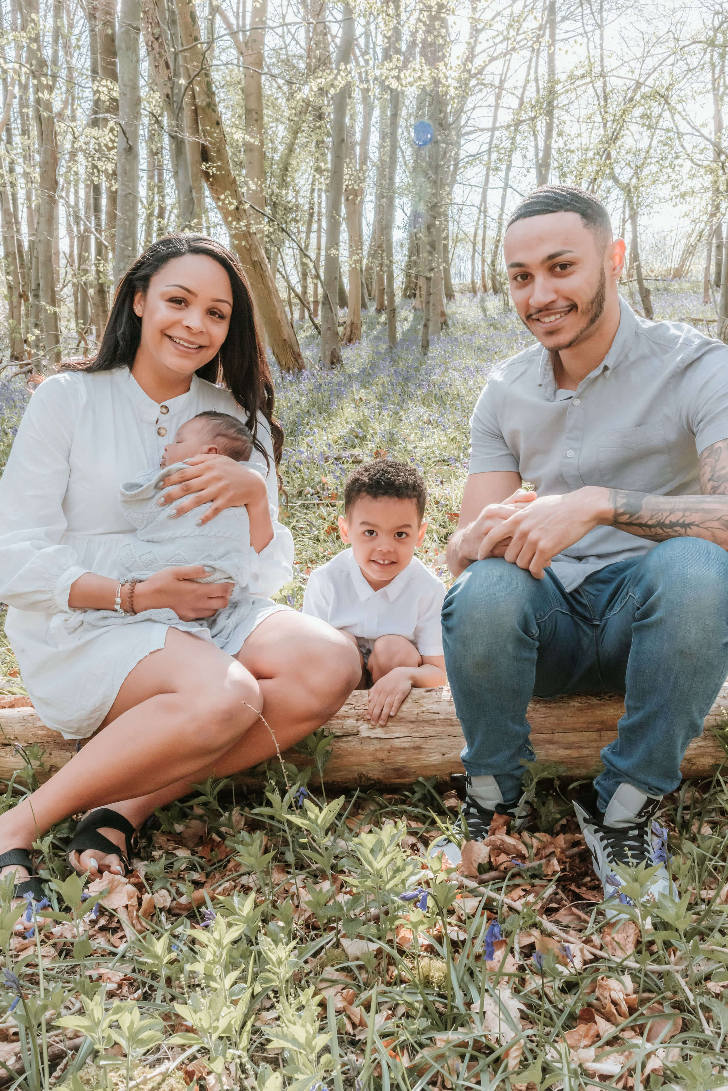 The Scantlebury Family sitting on a log of wood, shot by Gemma Randall ©