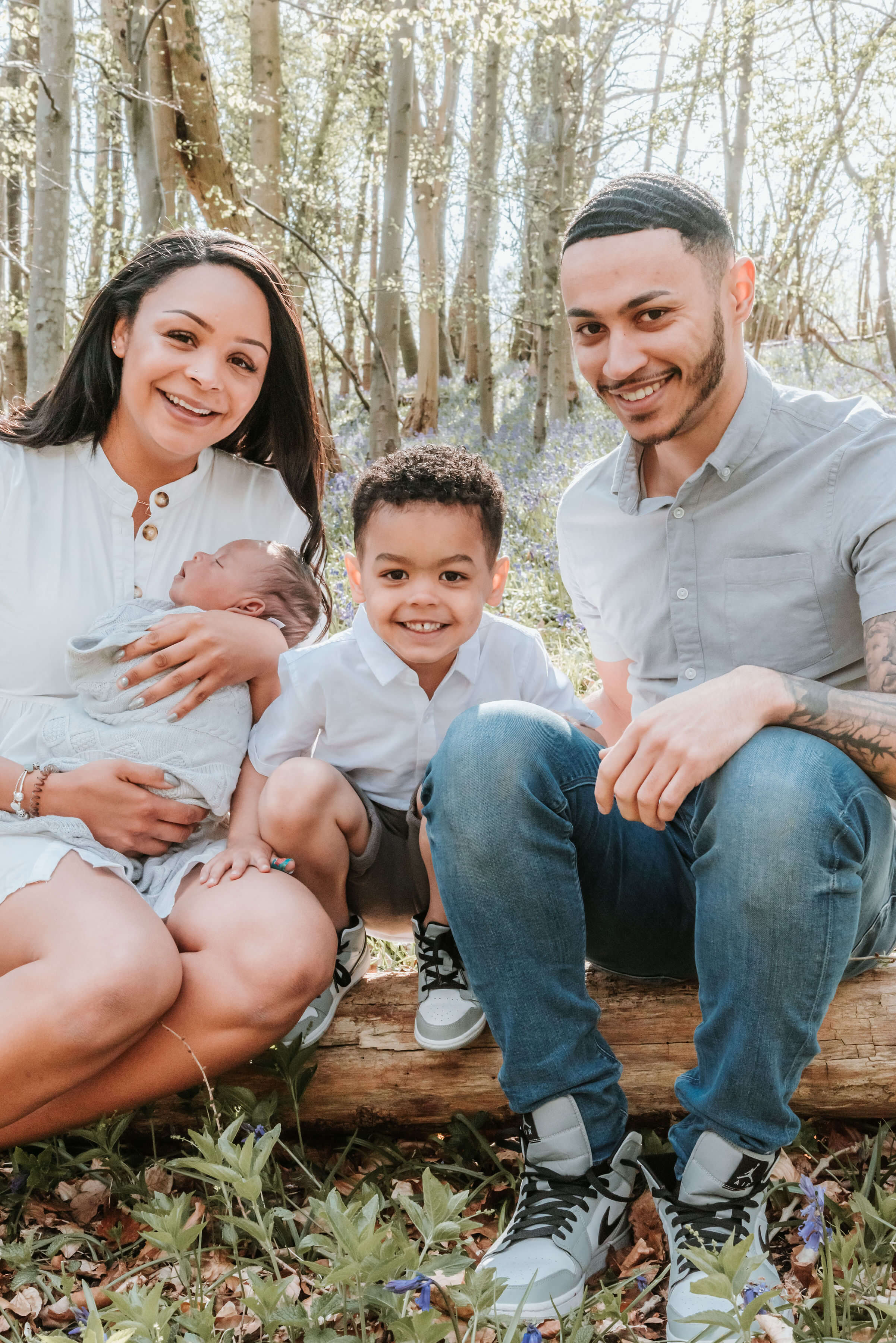 The Scantlebury's sitting on a log of wood, shot by Gemma Randall ©