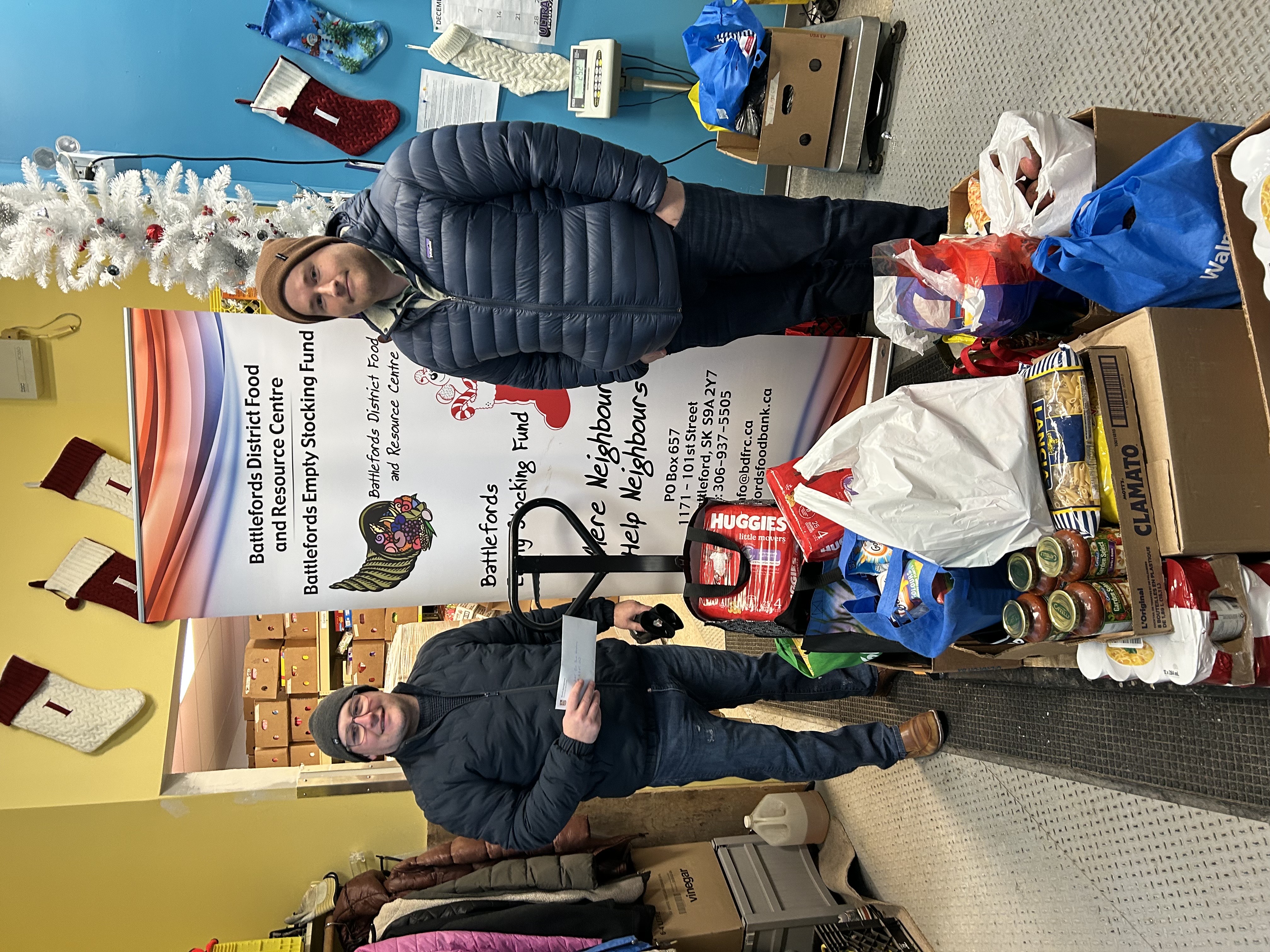 RBC presenting a cheque donation to support Christmas programs for kids.