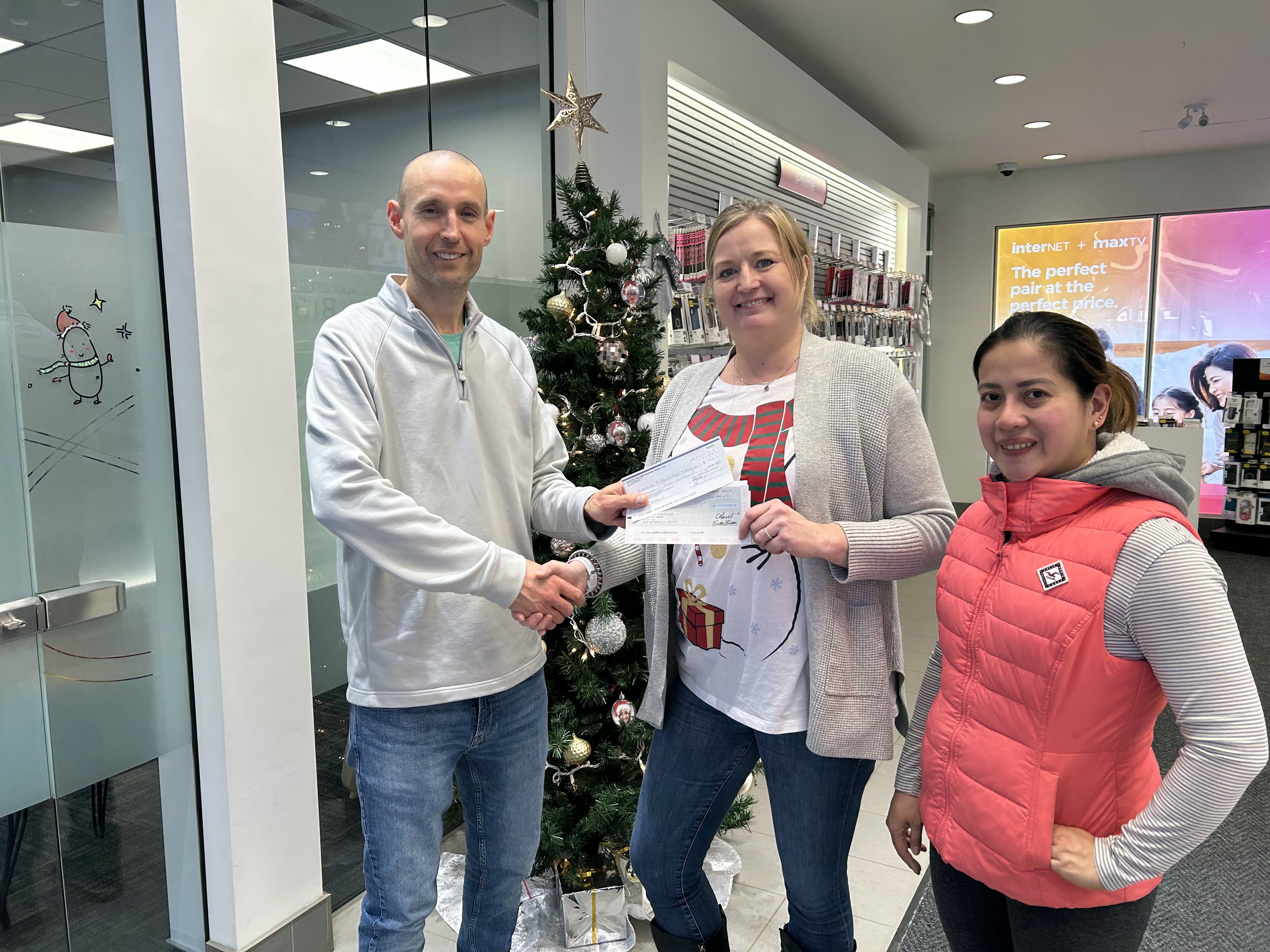 Group photo taken during the cheque handover from SaskTel