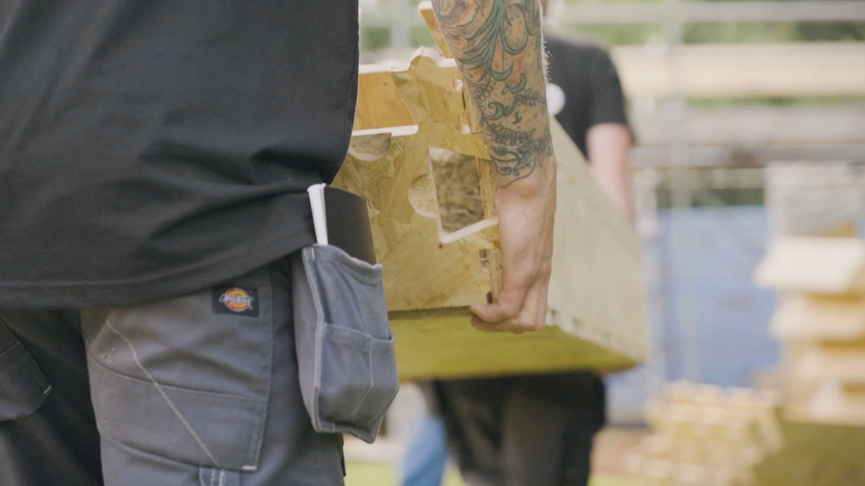 Closeup of WikiHouse block being carried by 2 people.