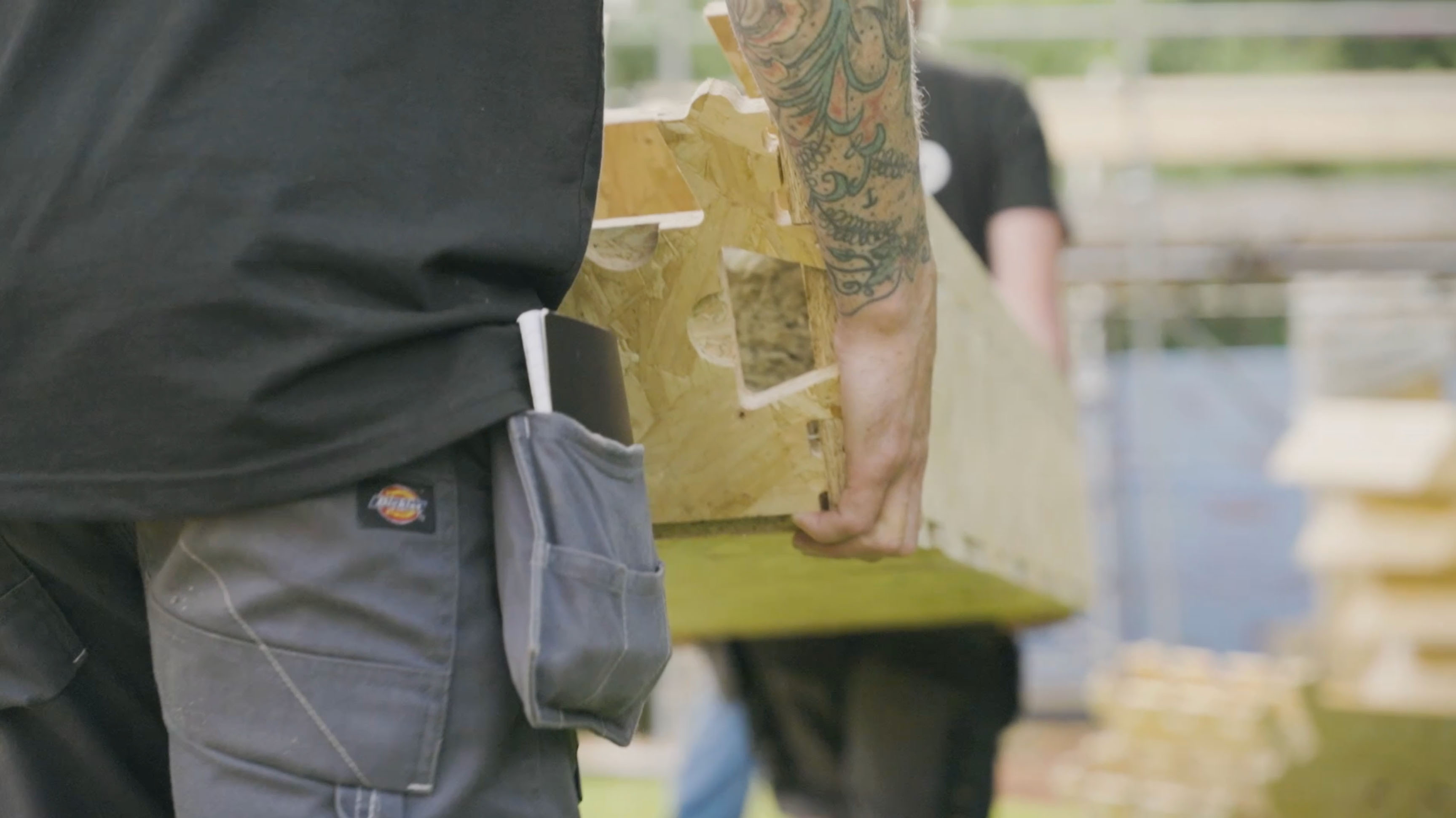 Closeup of WikiHouse block being carried by 2 people.