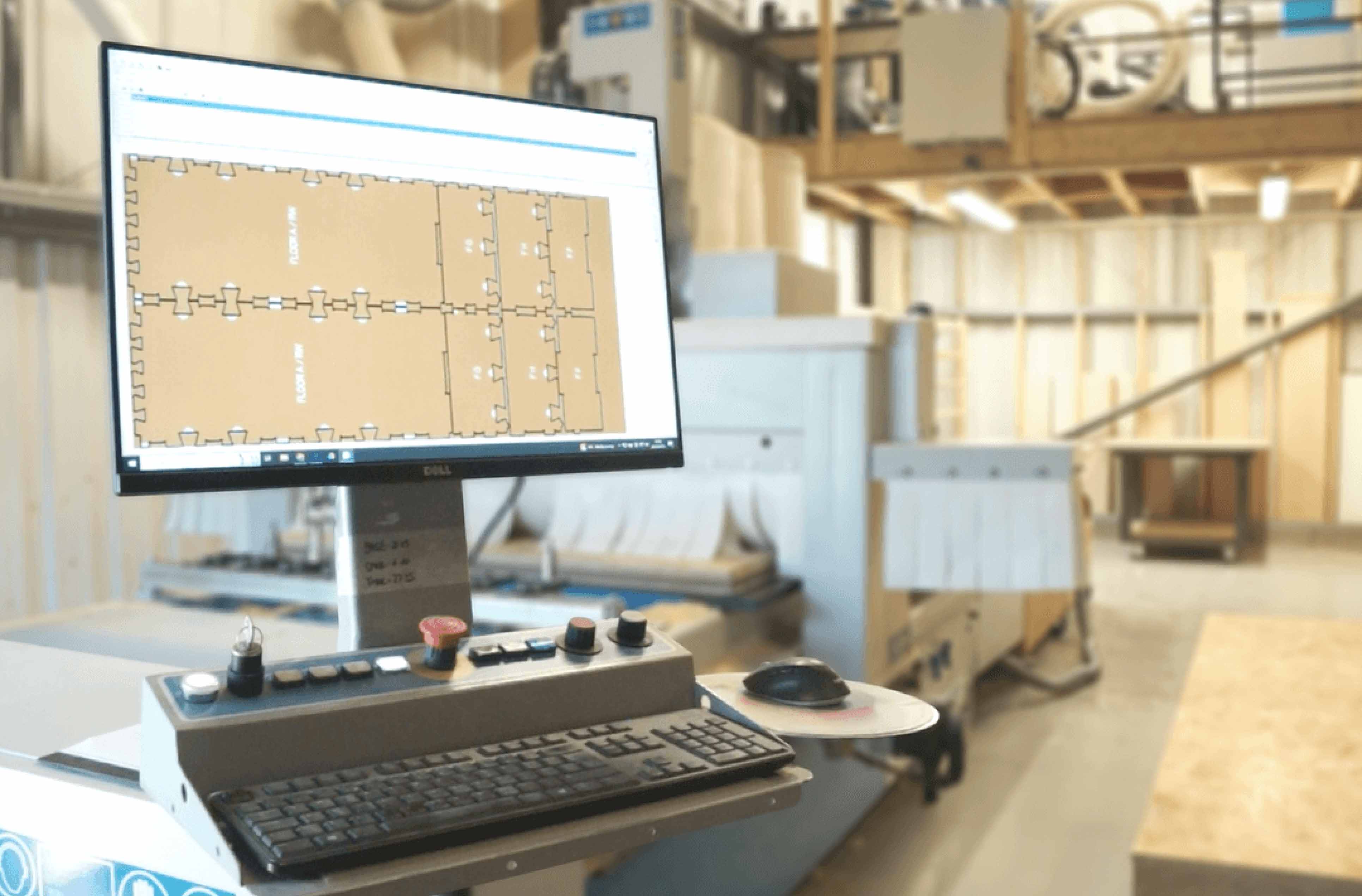 Computer screen in factory showing WikiHouse parts.