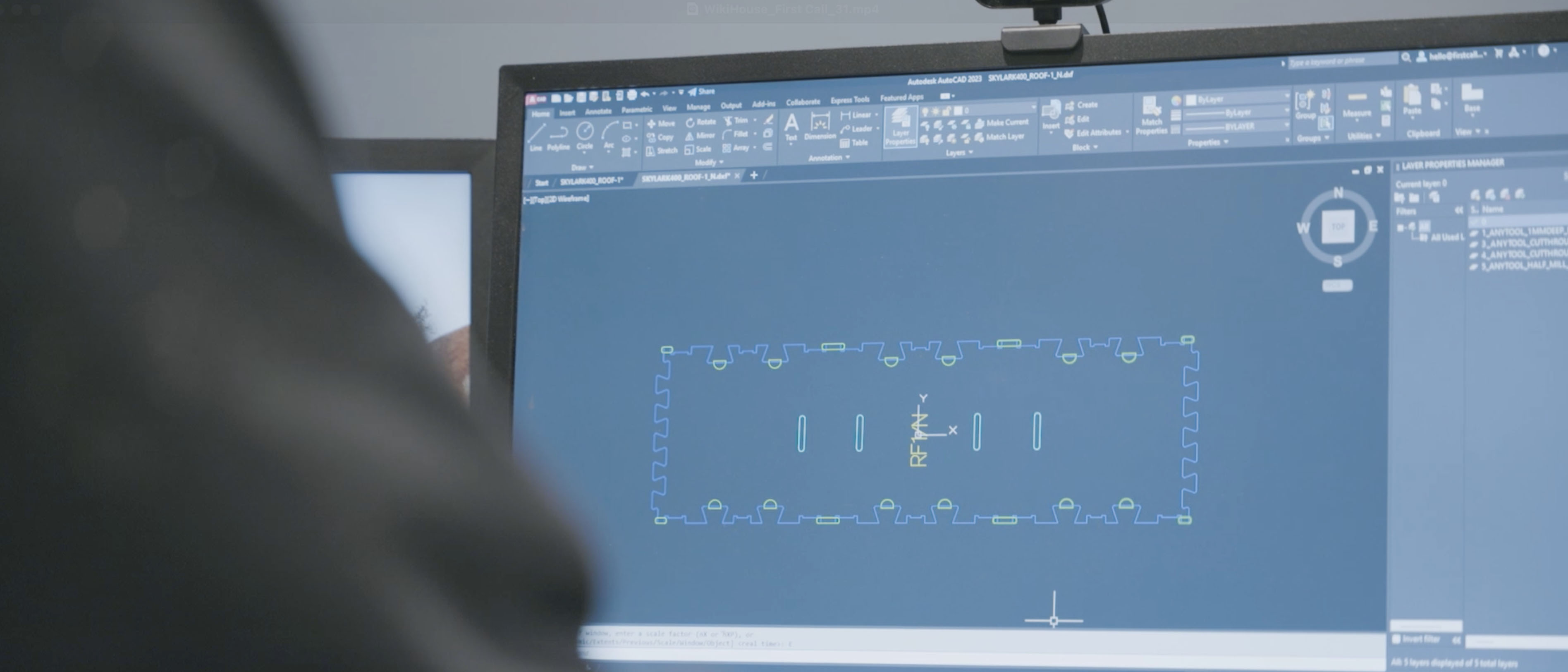 Closeup of CAD file shown on screen.