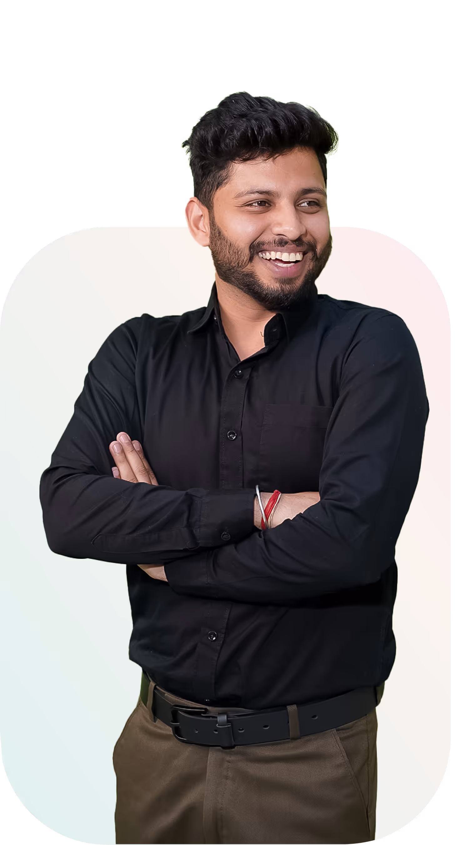 Smiling man in black shirt crossing arms, professional portrait.