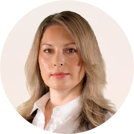Professional woman with long blonde hair in a white shirt.