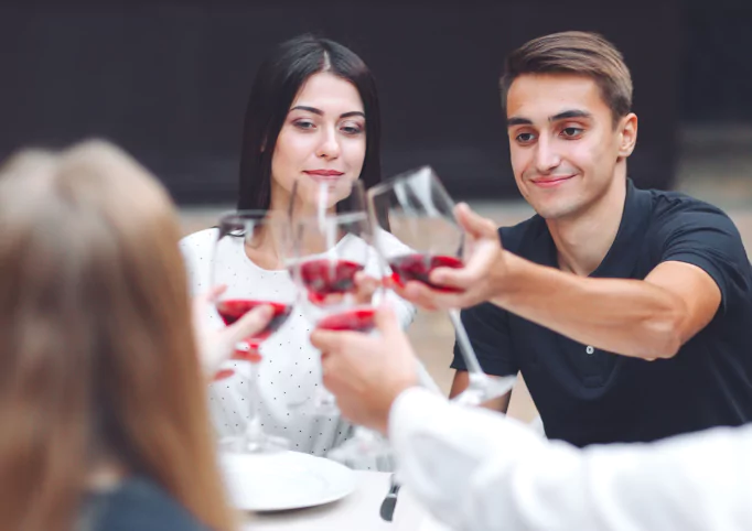 Feast-friends drink wine-restaurant