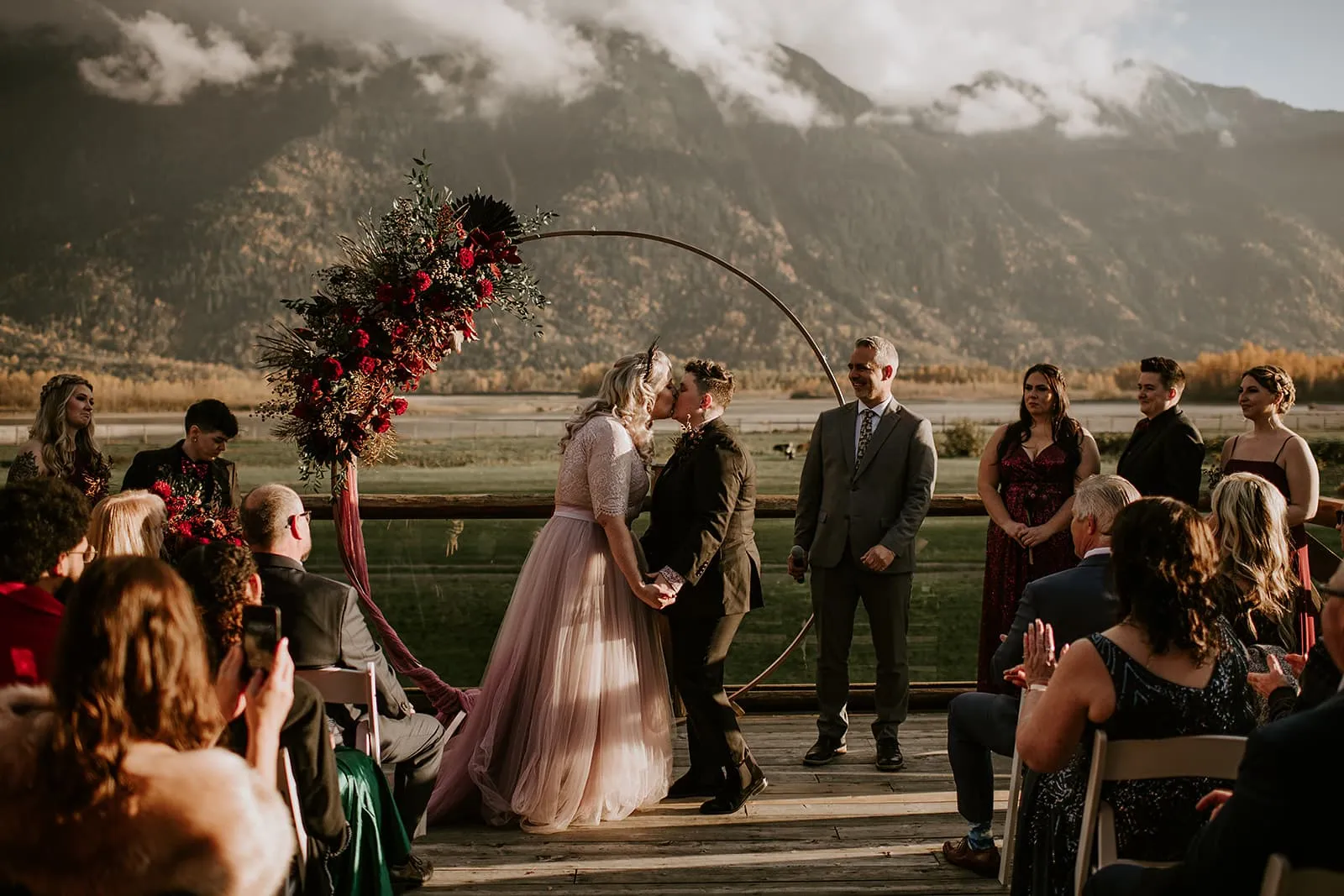 Two brides getting married on a deck
