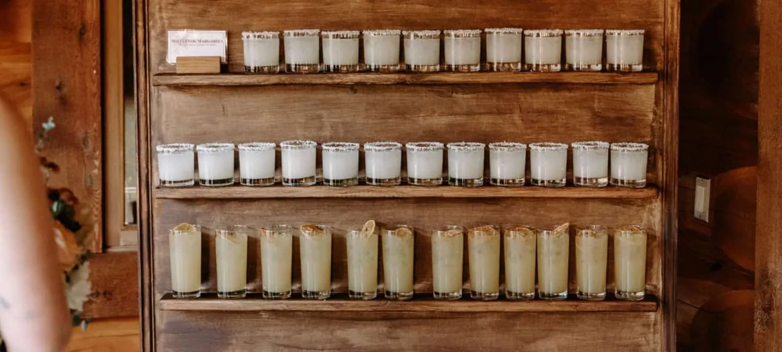 A cocktail wall filled with drinks at the Fraser River Lodge