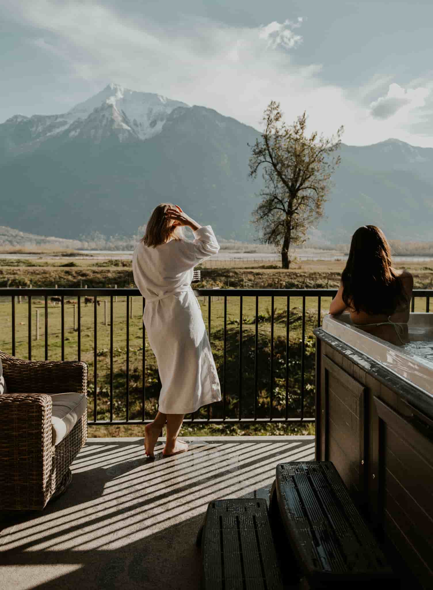 A group of girls holding a sturgeon in the river