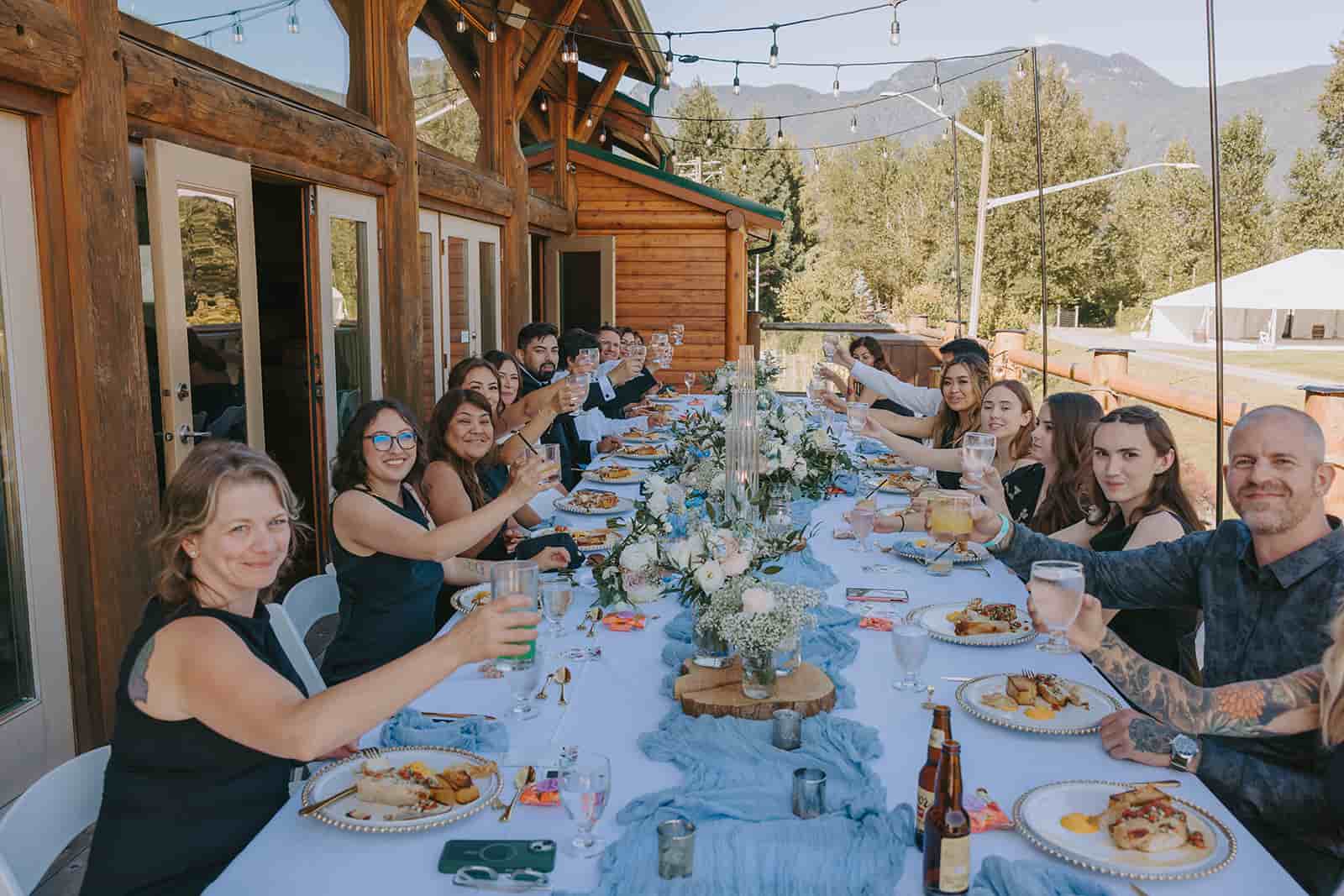 A group of men holding a sturgeon in the river