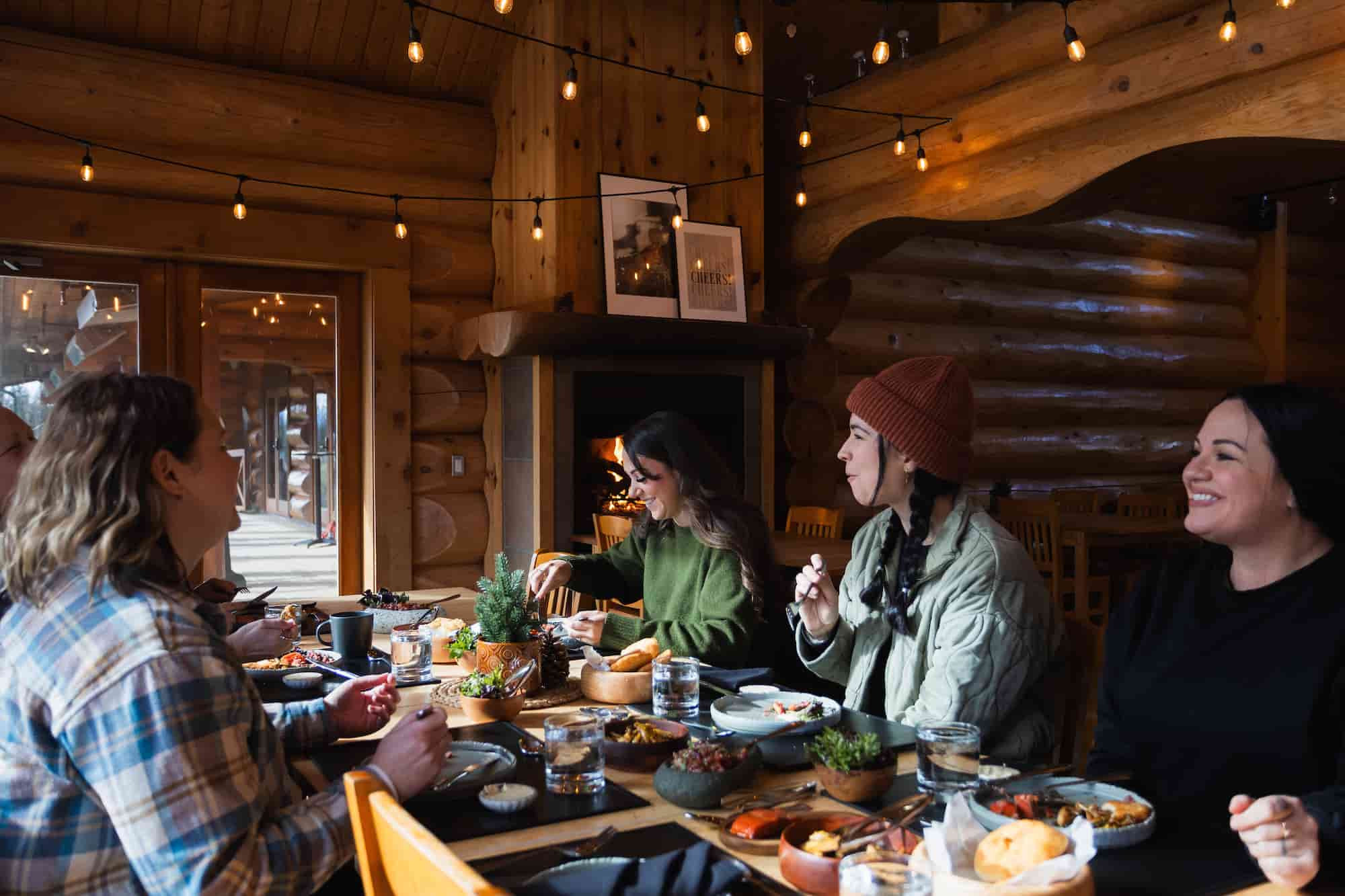 A group of friends eating at the Fraser River Lodge