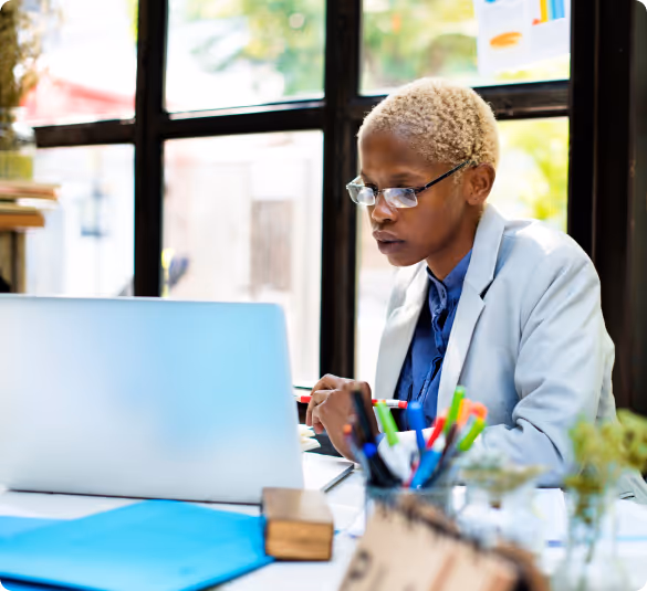 lady with glasses using a laptop