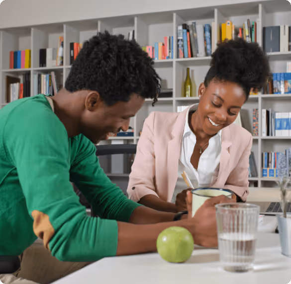 lady smiling while using a laptop