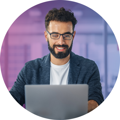 Man working on laptop in office.