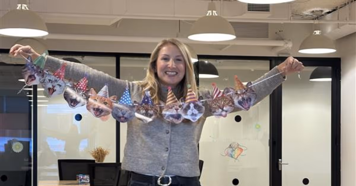 A CoreView employee putting up party decorations