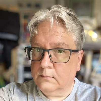 Headshot image of Simon Bisson the author of the book