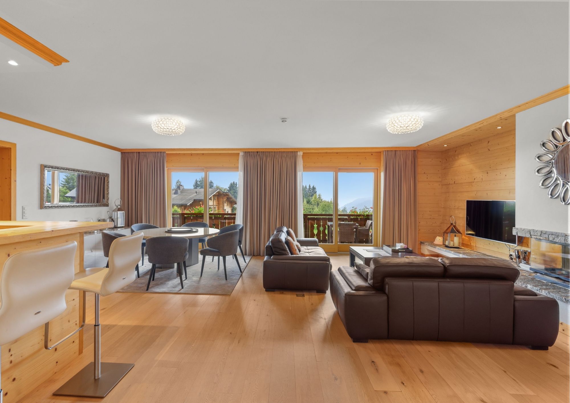 Chic, relaxed lounge in a suite at the Royalp Hotel & Spa chalet 