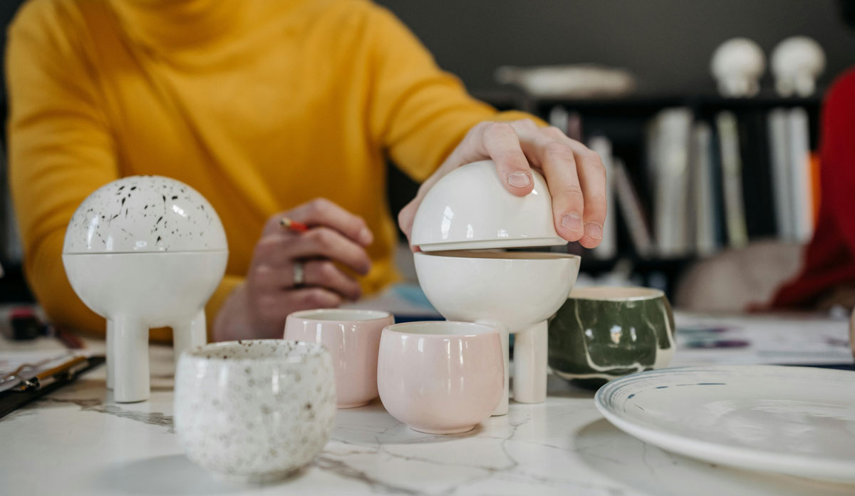 man holding round-shaped decorative element