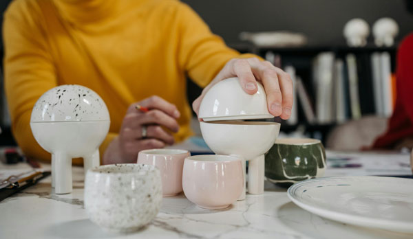 man holding round-shaped decorative element