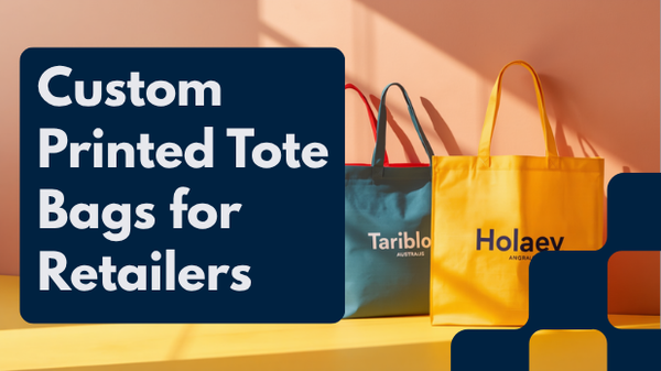 Rolls of canvas and non-woven polypropylene fabric beside printed tote bag samples, illustrating custom tote bag sourcing from China and Vietnam for Australian retailers