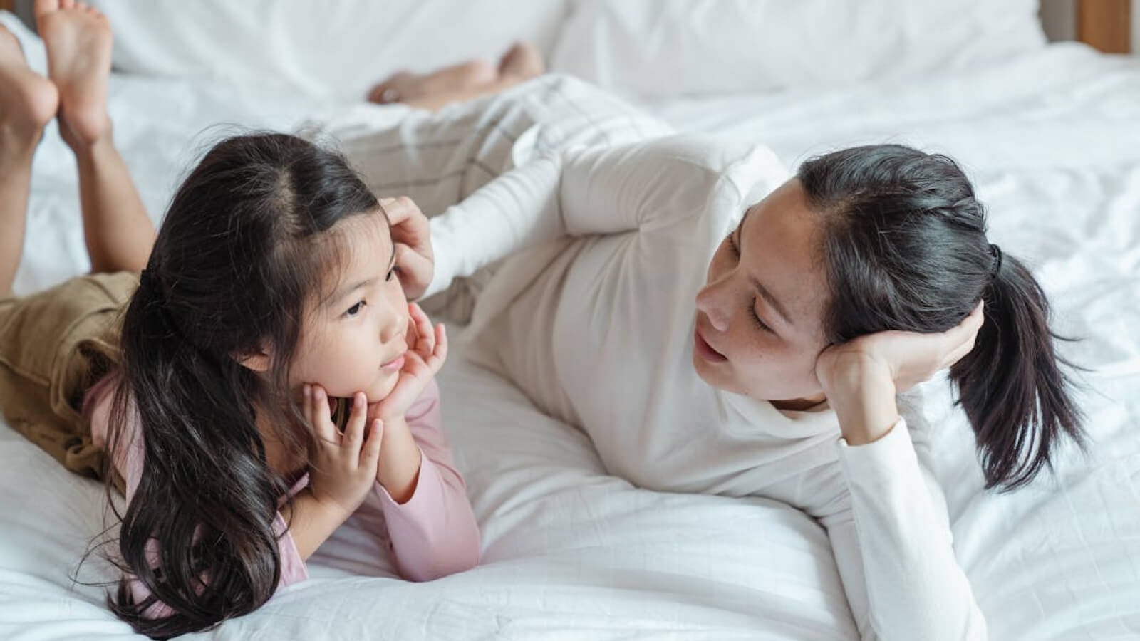 child telling a story to her mum 