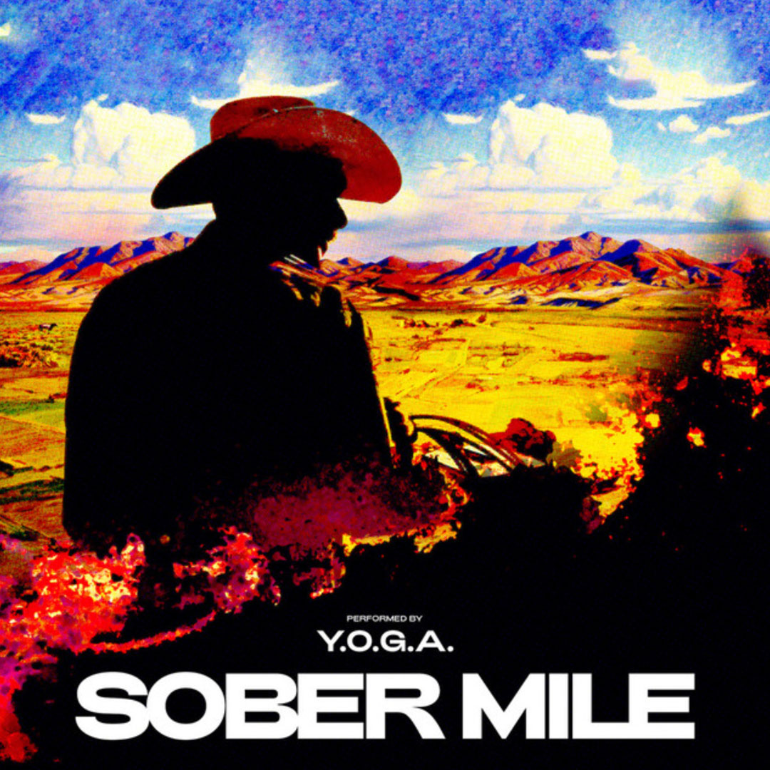 Silhouette of a person wearing a cowboy hat overlooking a colorful mountain landscape under a blue sky with clouds, with text 'Performed by Y.O.G.A. SOBER MILE'.