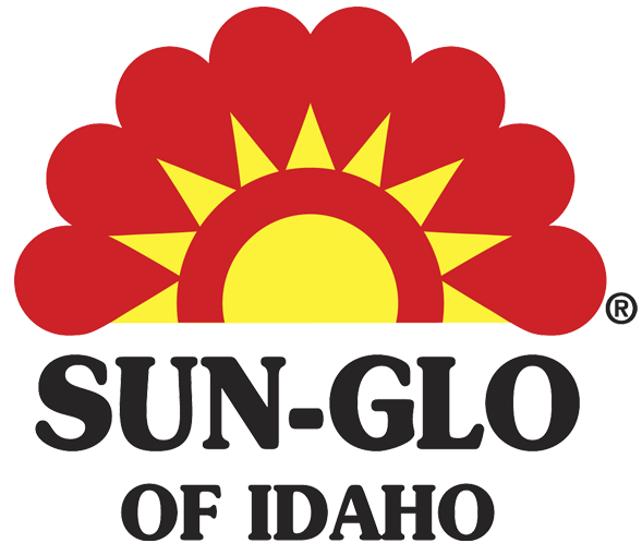 Logo with a stylized sun featuring a yellow semicircle with red triangular rays and a red cloud-like shape above, with the text 'SUN-GLO OF IDAHO' below in bold black letters.