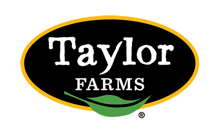 Taylor Farms logo with the word 'Taylor' in white, 'FARMS' below it, inside a black oval outlined in orange with a green leaf shape underneath.