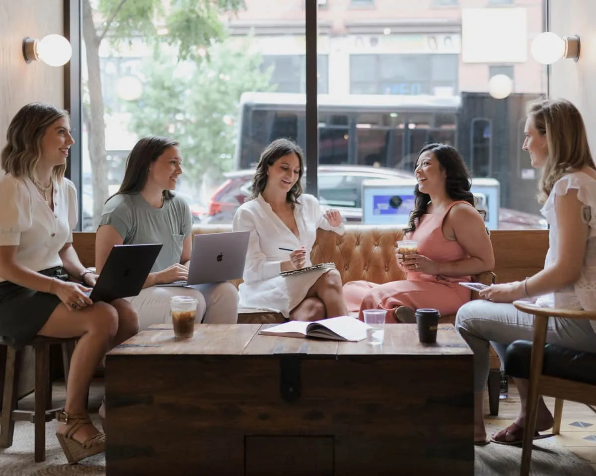 The Risely Health team working at a coffee shop
