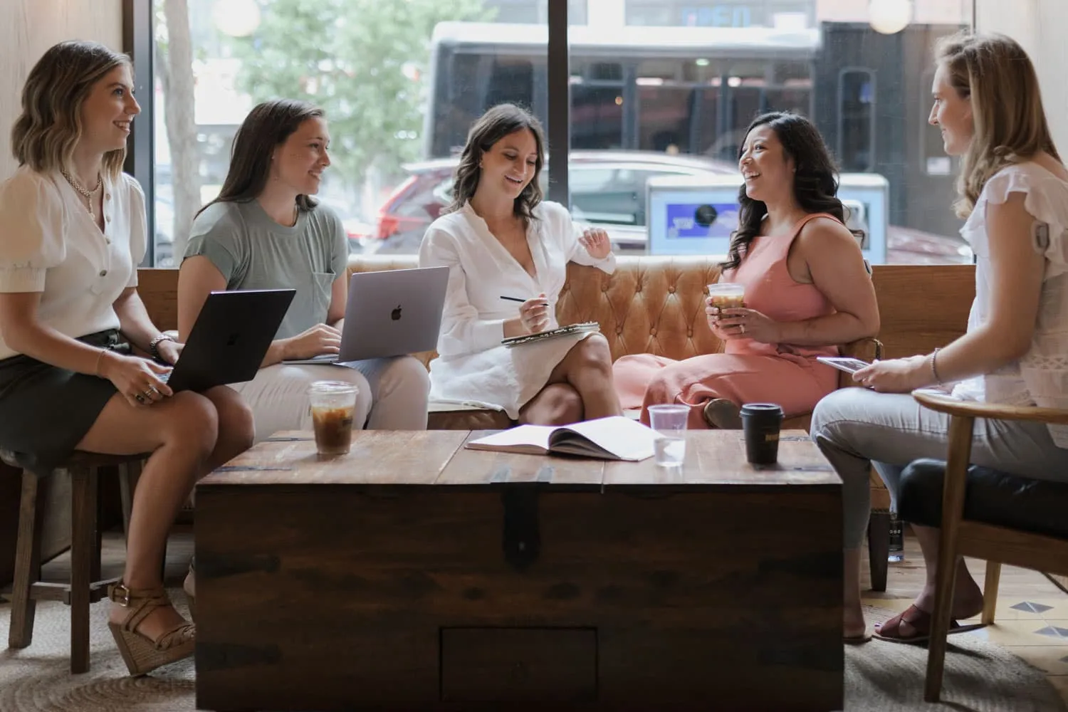 The Risely Health team working at a coffee shop