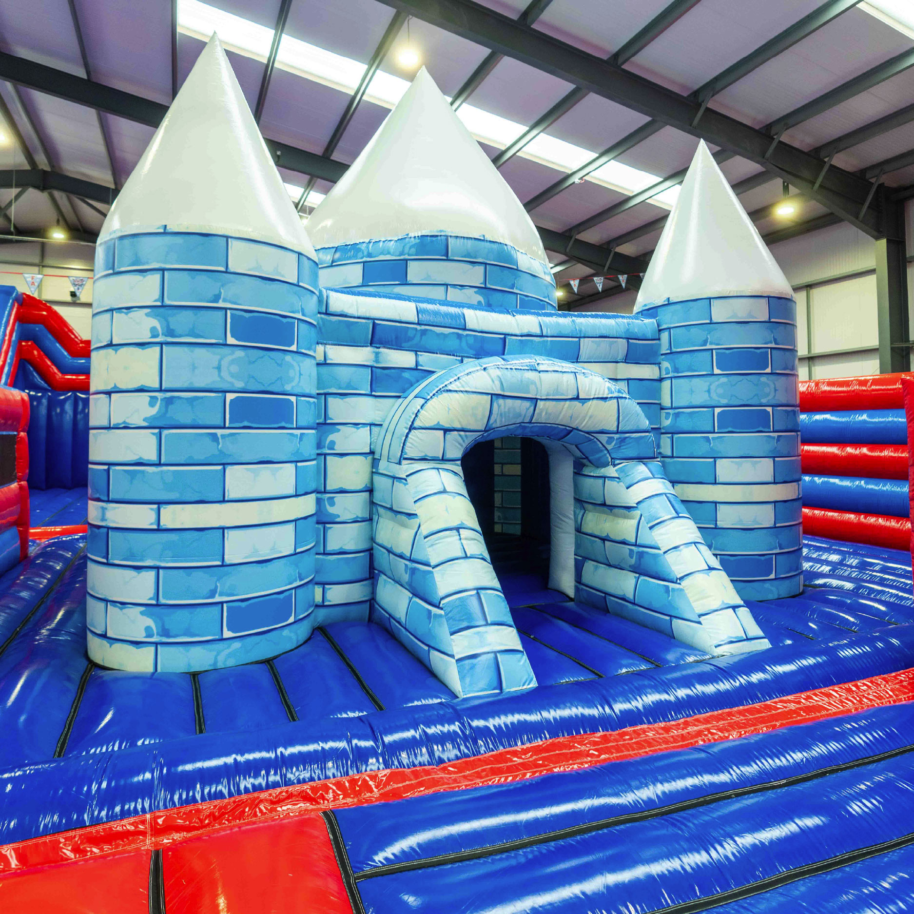 Happy kids running onto an inflatable playground