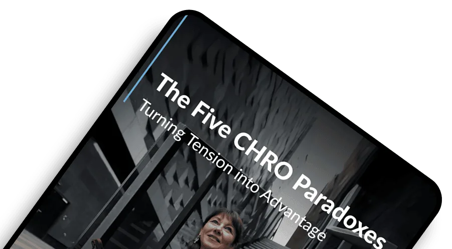 Cover of a report titled 'The Five CHRO Paradoxes: Turning Tension into Advantage' featuring a woman in a beige suit sitting on stairs in an urban setting.