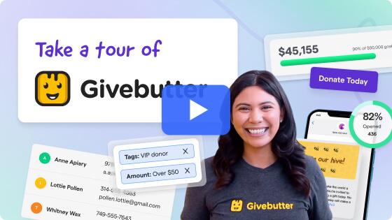 Smiling woman wearing a Givebutter t-shirt standing in front of a promotional graphic that says 'Take a tour of Givebutter,' with screenshots of donation tracking and fundraising features in the background.