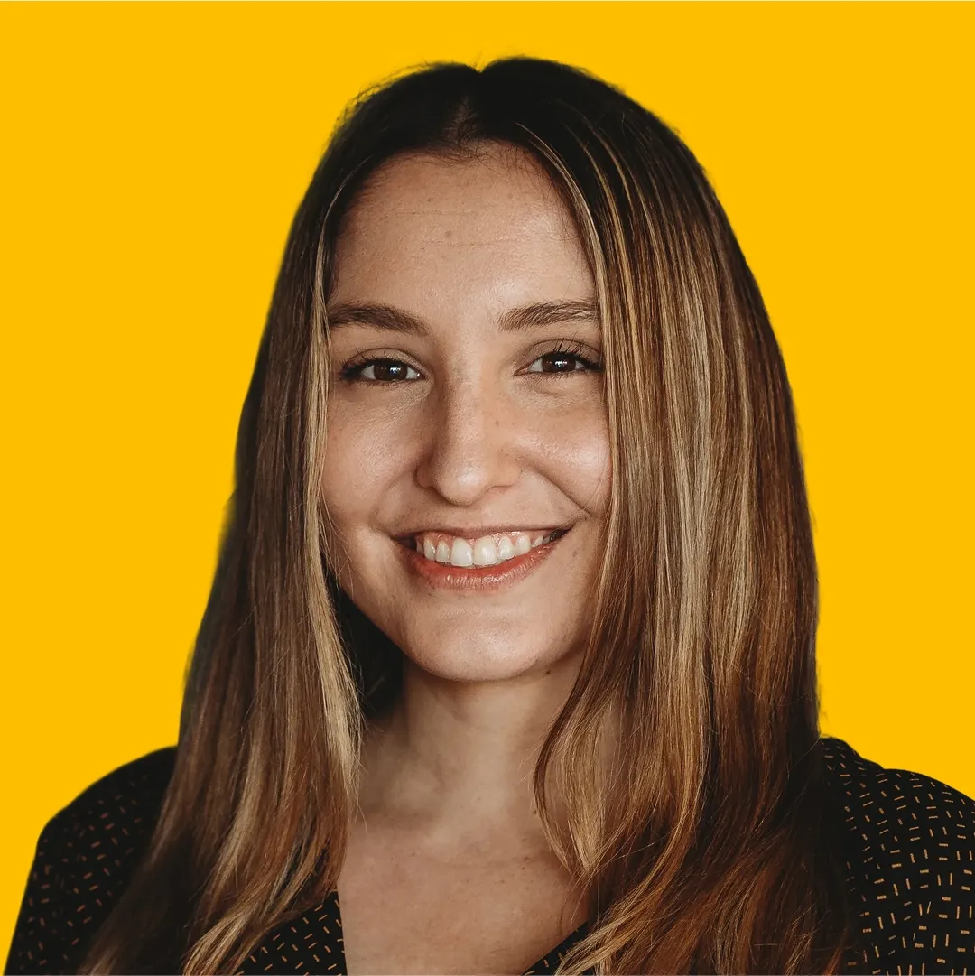 Angela's headshot against a yellow background