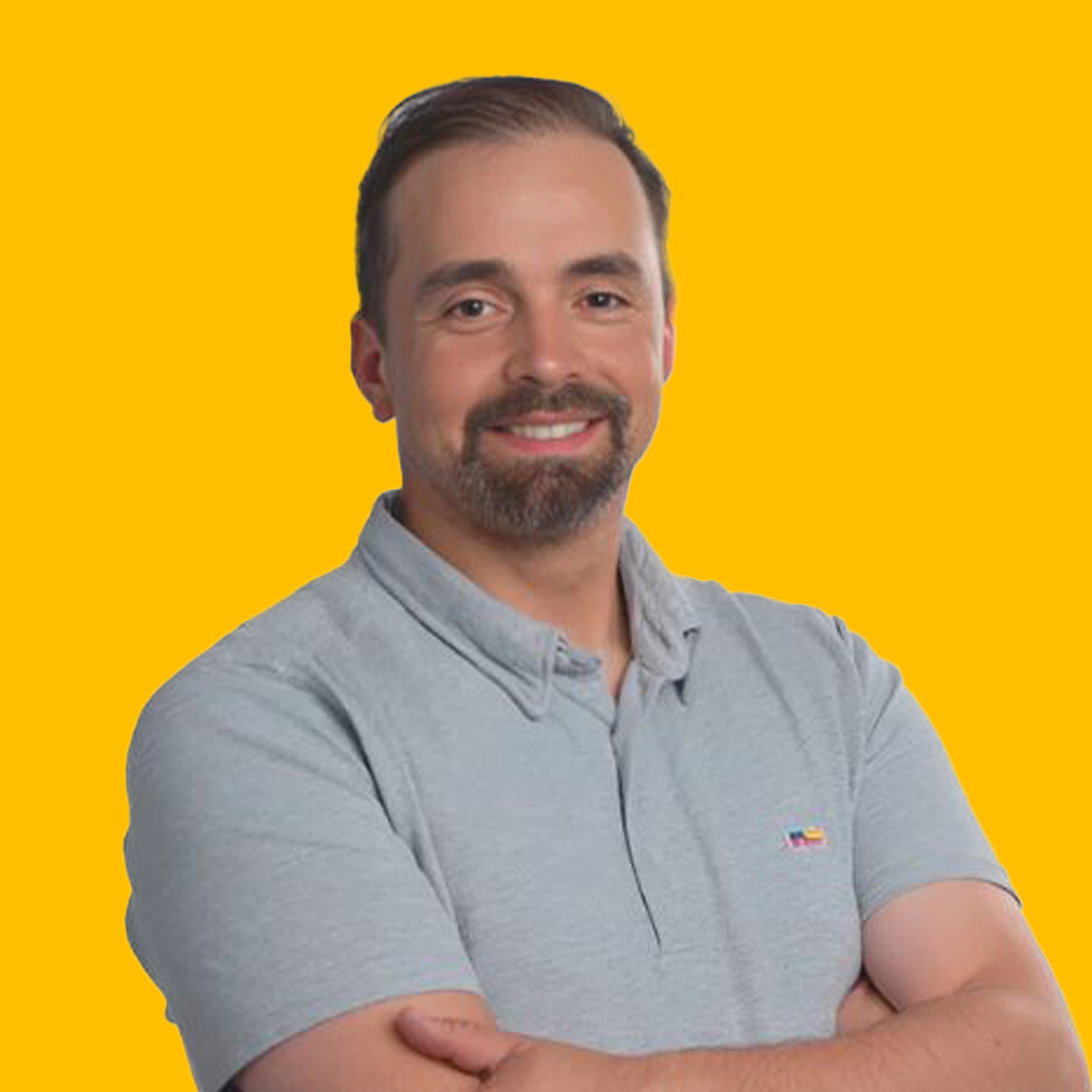 Andrew's headshot against a yellow background