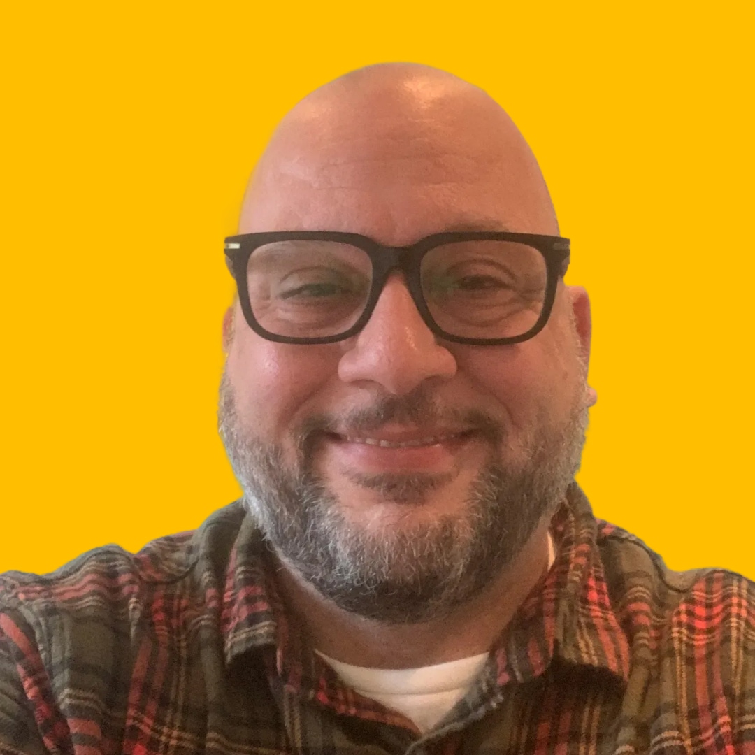 Giacomo's headshot against yellow background