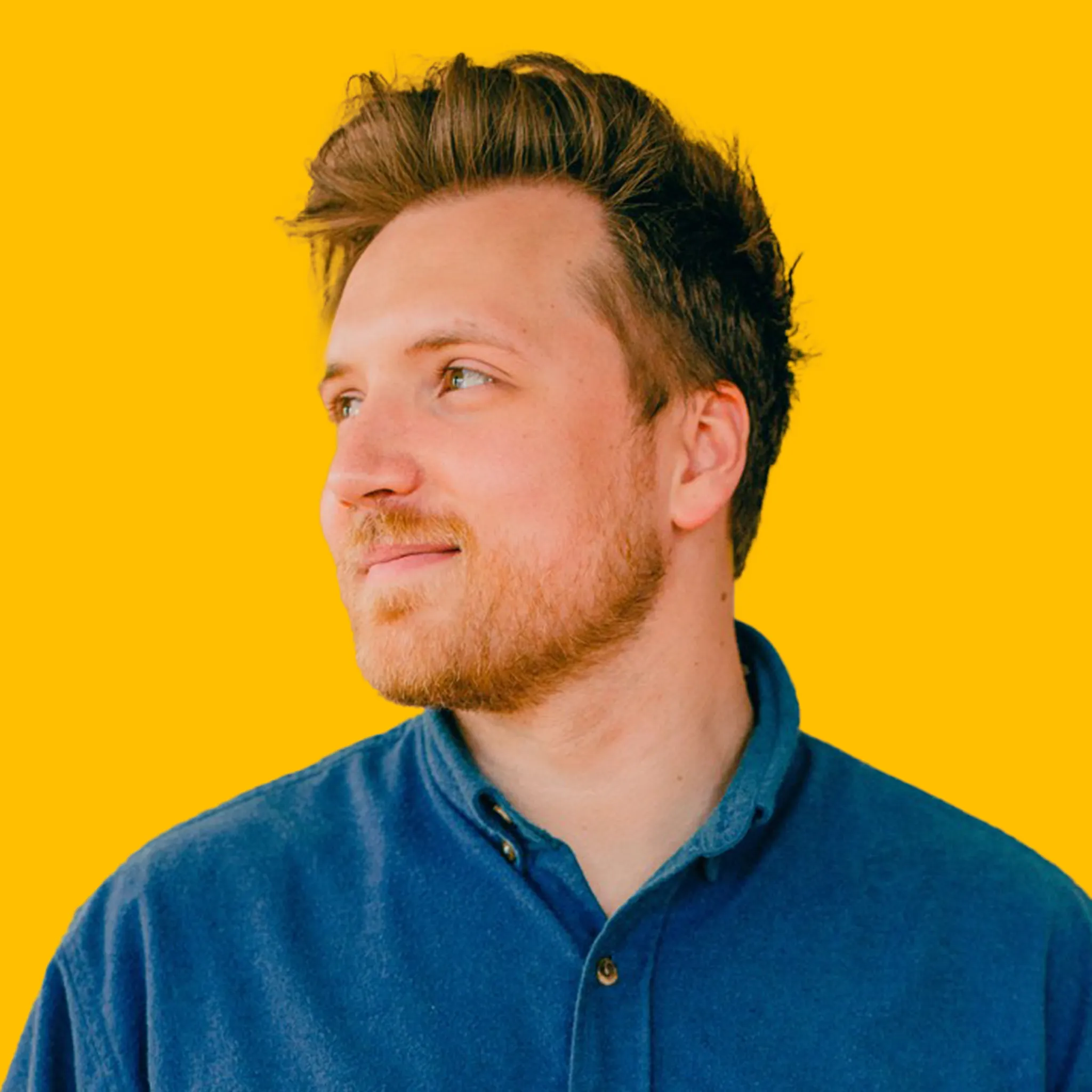 Joel Swick's headshot against a yellow background