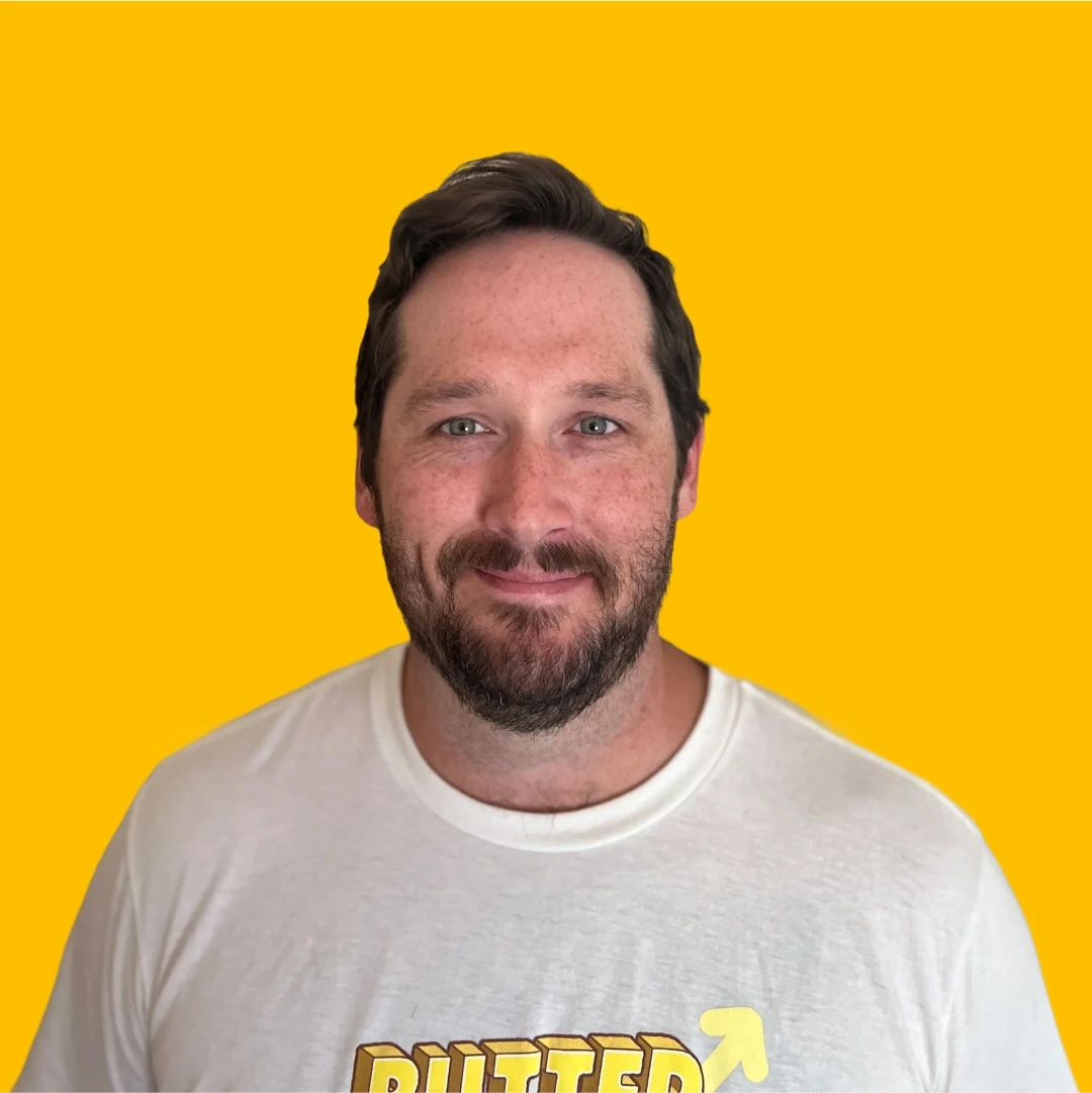Joey's headshot against a yellow background