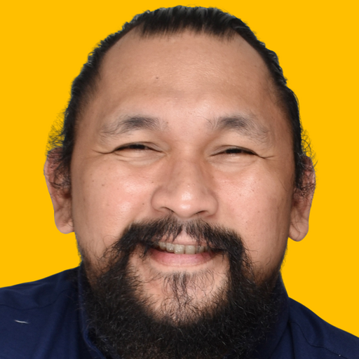 Simon's headshot against a yellow background